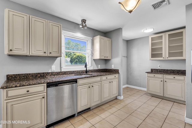 55 S Ave, Bayville, NJ 08721 - kitchen featuring stainless steel dishwasher, a sink, baseboards, dark stone counters, and glass insert cabinets