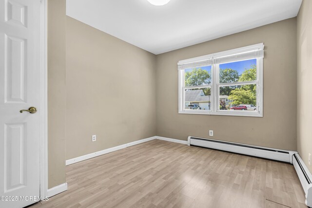 55 S Ave, Bayville, NJ 08721 - unfurnished room featuring light wood finished floors, baseboards, and a baseboard radiator
