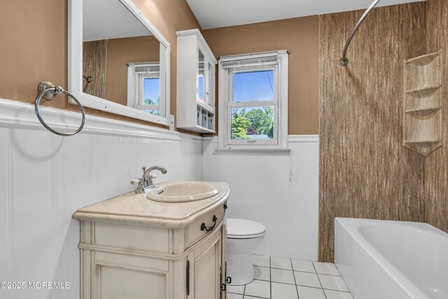 55 S Ave, Bayville, NJ 08721 - full bathroom with a wainscoted wall, vanity, plenty of natural light, tile patterned flooring, and toilet