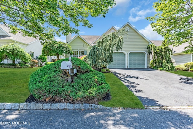 123 Skyline Dr, Lakewood, NJ 08701 - view of property hidden behind natural elements featuring asphalt driveway, an attached garage, and a front lawn
