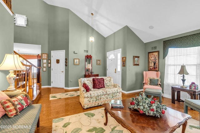123 Skyline Dr, Lakewood, NJ 08701 - living area with wood finished floors, baseboards, and high vaulted ceiling