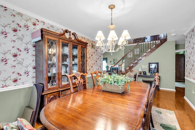 123 Skyline Dr, Lakewood, NJ 08701 - dining space with wallpapered walls, a chandelier, stairway, wood finished floors, and ornamental molding