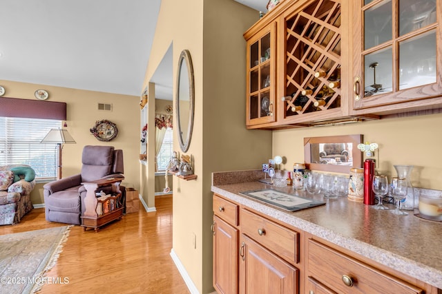123 Skyline Dr, Lakewood, NJ 08701 - indoor dry bar featuring healthy amount of natural light, light wood-type flooring, and baseboards