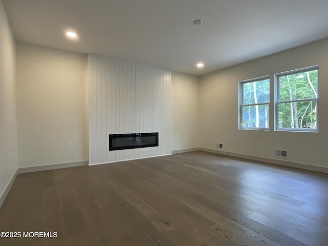 830 Hulses Corner Rd, Howell, NJ 07731 - unfurnished living room with wood finished floors, a fireplace, recessed lighting, and baseboards