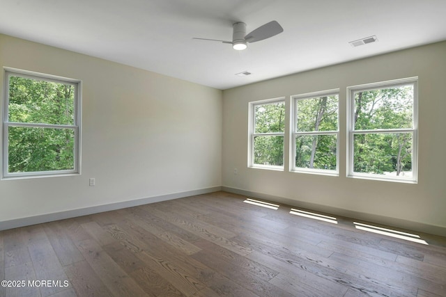 830 Hulses Corner Rd, Howell, NJ 07731 - empty room with healthy amount of natural light, hardwood / wood-style flooring, and a ceiling fan