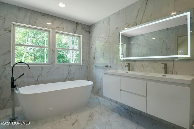 830 Hulses Corner Rd, Howell, NJ 07731 - full bath featuring marble tiled flooring, double vanity, and a freestanding bath