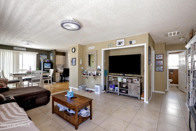 67 Flax Isle Dr, Little Egg Harbor, NJ 08087 - living area with baseboards, light tile patterned floors, and a textured ceiling