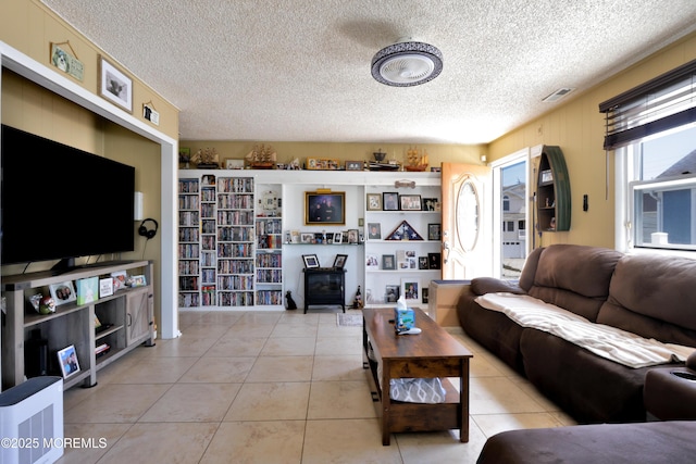 67 Flax Isle Dr, Little Egg Harbor, NJ 08087 - living area featuring a textured ceiling and light tile patterned floors