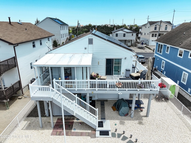 67 Flax Isle Dr, Little Egg Harbor, NJ 08087 - rear view of house featuring a wooden deck, stairs, a residential view, a fenced backyard, and metal roof