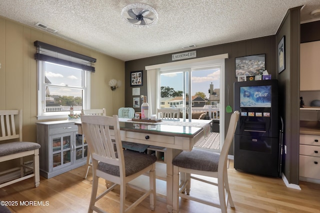 67 Flax Isle Dr, Little Egg Harbor, NJ 08087 - dining space with light wood-type flooring and a textured ceiling