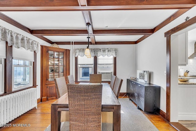 129 Bridge Ave, Bay Head, NJ 08742 - dining area with radiator heating unit, light wood-style flooring, baseboards, beamed ceiling, and coffered ceiling
