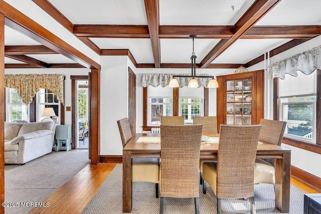 129 Bridge Ave, Bay Head, NJ 08742 - dining space with coffered ceiling, baseboards, hardwood / wood-style flooring, beam ceiling, and a chandelier