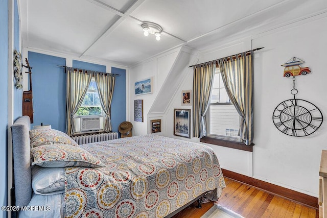 129 Bridge Ave, Bay Head, NJ 08742 - bedroom with baseboards, radiator, hardwood / wood-style floors, crown molding, and cooling unit
