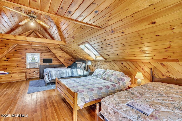 129 Bridge Ave, Bay Head, NJ 08742 - bedroom featuring wood ceiling, a skylight, wood walls, light wood-style flooring, and lofted ceiling