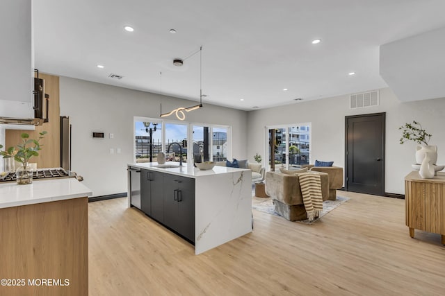 401 Boulevard 201, Seaside Heights, NJ 08751 - kitchen with light wood finished floors, a sink, a kitchen island with sink, open floor plan, and recessed lighting