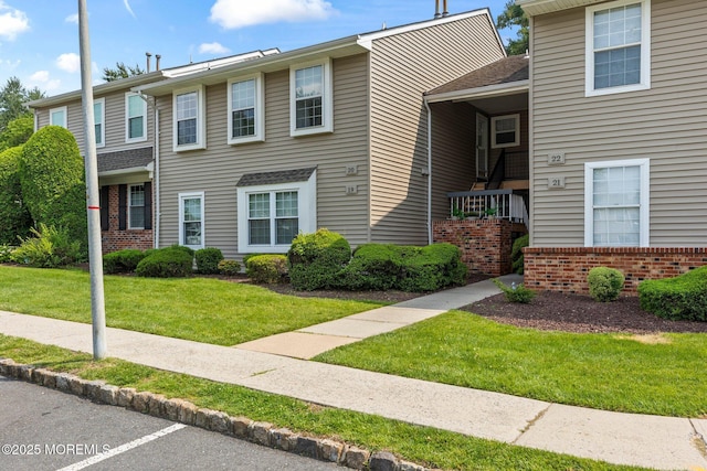 20 Lindsey Cir Unit 20, Old Bridge, NJ 08857 - view of front of house featuring brick siding and a front yard