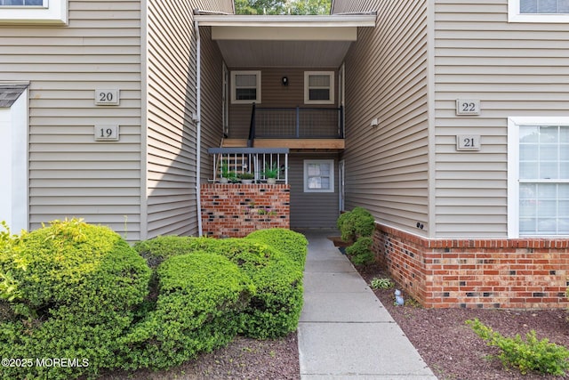 20 Lindsey Cir Unit 20, Old Bridge, NJ 08857 - view of exterior entry with brick siding and a balcony
