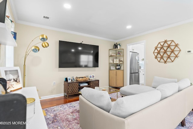 20 Lindsey Cir Unit 20, Old Bridge, NJ 08857 - living area with ornamental molding, wood finished floors, baseboards, and recessed lighting