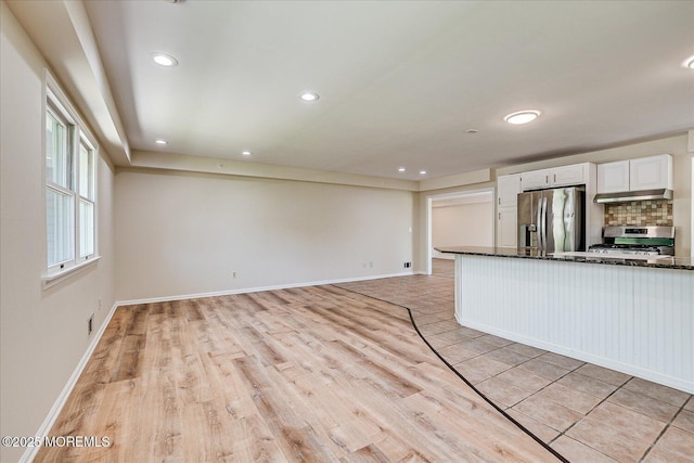 44 Oak Ter, Howell, NJ 07731 - kitchen with stainless steel appliances, light wood-type flooring, white cabinets, tasteful backsplash, and recessed lighting