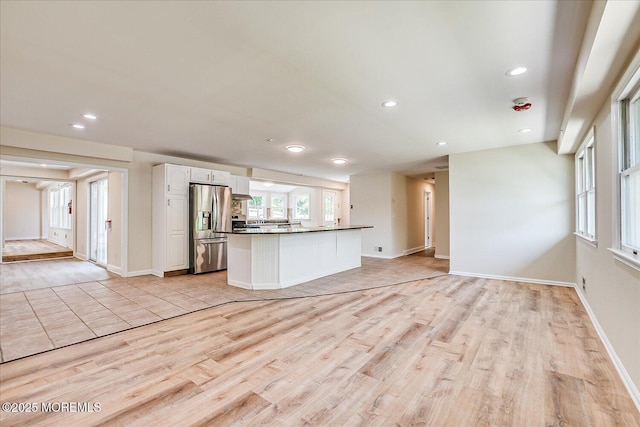 44 Oak Ter, Howell, NJ 07731 - kitchen featuring stainless steel fridge with ice dispenser, light wood finished floors, white cabinets, dark countertops, and recessed lighting