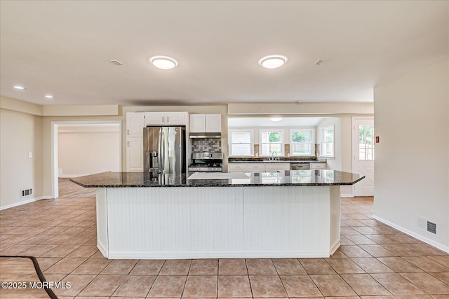 44 Oak Ter, Howell, NJ 07731 - kitchen with stainless steel appliances, white cabinetry, light tile patterned floors, baseboards, and recessed lighting