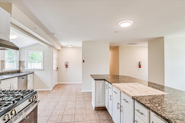 44 Oak Ter, Howell, NJ 07731 - kitchen featuring stainless steel appliances, dark stone countertops, white cabinets, and baseboards