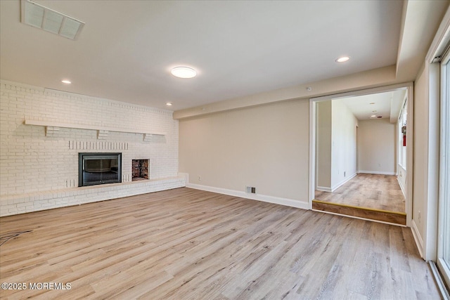 44 Oak Ter, Howell, NJ 07731 - unfurnished living room featuring wood finished floors, a fireplace, recessed lighting, and baseboards
