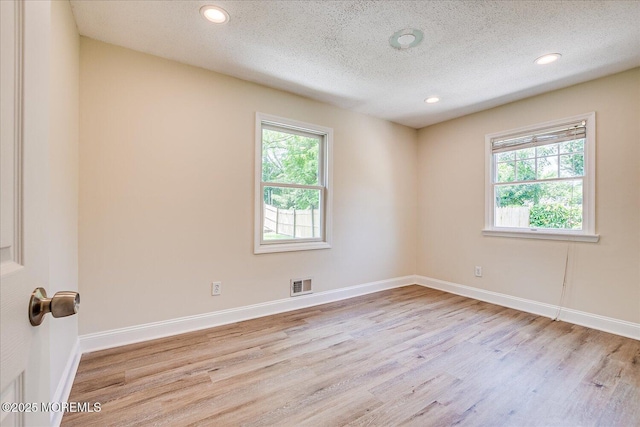 44 Oak Ter, Howell, NJ 07731 - empty room featuring wood finished floors, a textured ceiling, recessed lighting, and baseboards