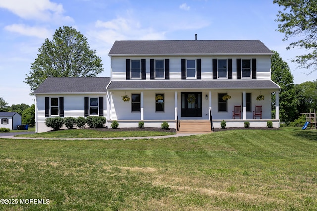 69 Eayrestown Rd, Medford, NJ 08055 - colonial house with a porch, a playground, and a front yard