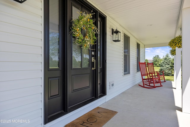 69 Eayrestown Rd, Medford, NJ 08055 - doorway to property with a porch