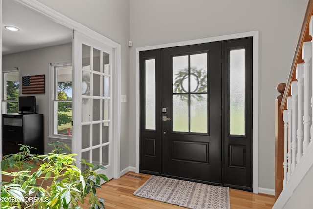69 Eayrestown Rd, Medford, NJ 08055 - foyer entrance with light wood-style flooring, stairway, and healthy amount of natural light