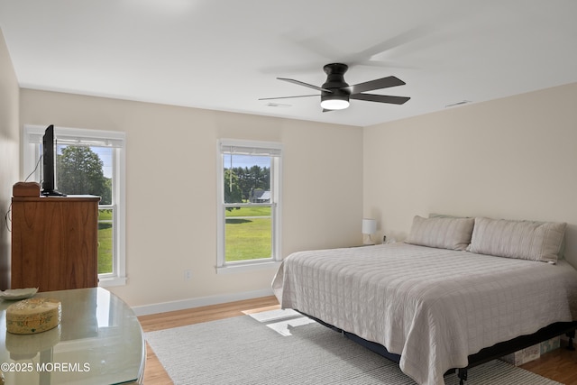 69 Eayrestown Rd, Medford, NJ 08055 - bedroom with multiple windows, light wood-style flooring, and baseboards