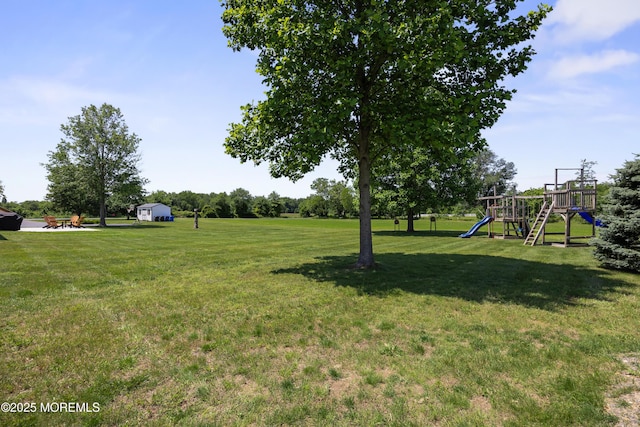 69 Eayrestown Rd, Medford, NJ 08055 - view of grassy yard featuring an outdoor structure