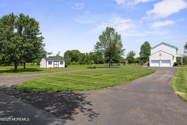 69 Eayrestown Rd, Medford, NJ 08055 - view of grassy yard with an outdoor structure and driveway