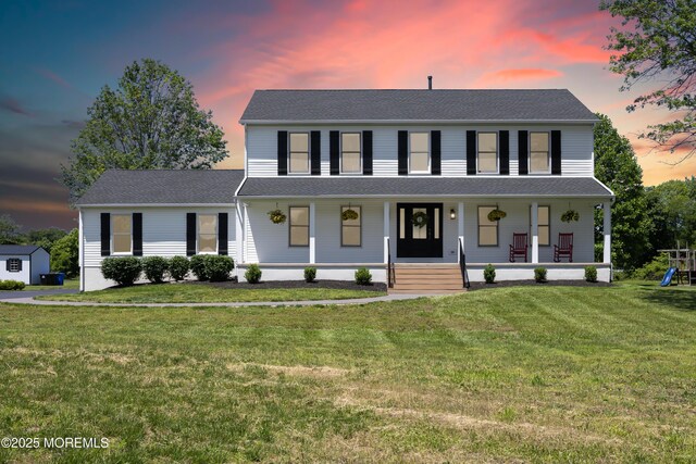 69 Eayrestown Rd, Medford, NJ 08055 - colonial house with covered porch, a yard, and a playground