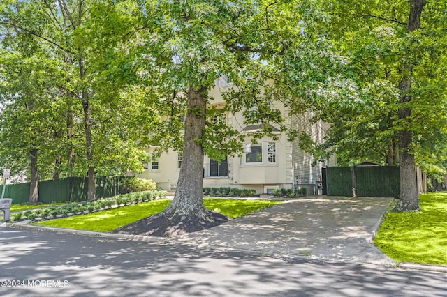 1501 Pine Park Ave, Lakewood, NJ 08701 - view of property hidden behind natural elements featuring concrete driveway