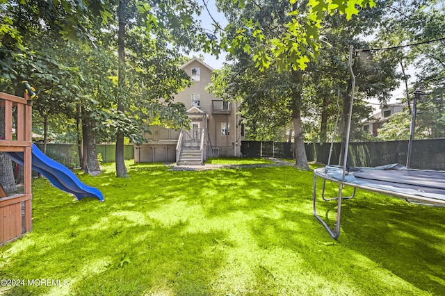 1501 Pine Park Ave, Lakewood, NJ 08701 - view of yard featuring a trampoline and a playground