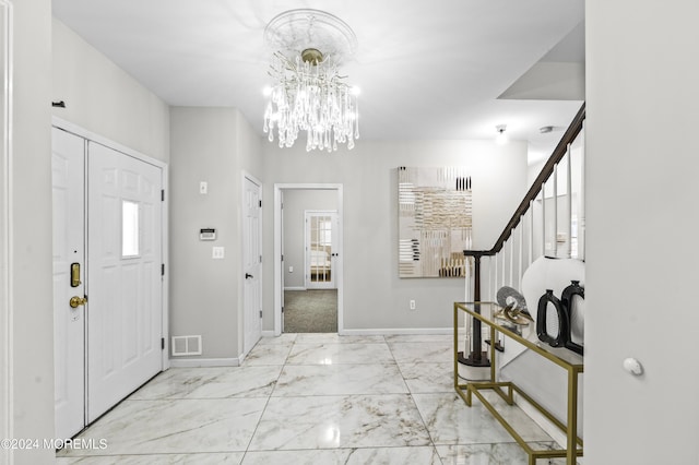 1501 Pine Park Ave, Lakewood, NJ 08701 - foyer with marble look tiles, a chandelier, baseboards, and stairs
