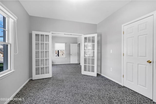 1501 Pine Park Ave, Lakewood, NJ 08701 - unfurnished room with french doors, dark carpet, and plenty of natural light