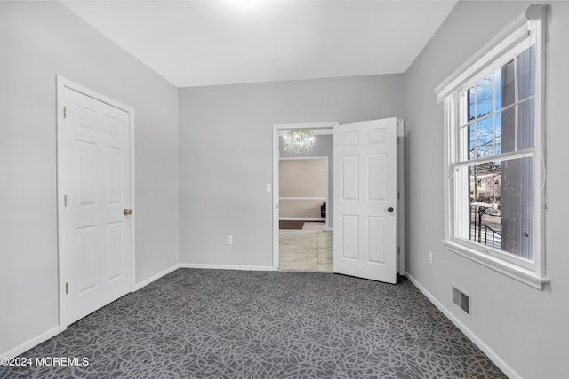 1501 Pine Park Ave, Lakewood, NJ 08701 - unfurnished bedroom featuring multiple windows, carpet, and baseboards