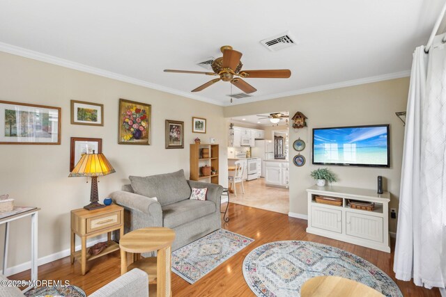 10 Weybridge Pl, Manchester, NJ 08759 - living room featuring ceiling fan, ornamental molding, baseboards, and light wood finished floors