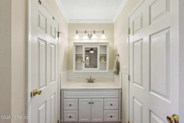 10 Weybridge Pl, Manchester, NJ 08759 - bathroom with vanity, crown molding, ceiling fan, and decorative backsplash