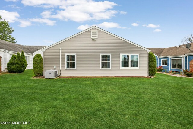 10 Weybridge Pl, Manchester, NJ 08759 - back of house with a lawn and central AC unit