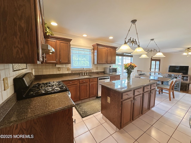 22 Enclosure Dr, Morganville, NJ 07751 - kitchen with appliances with stainless steel finishes, ventilation hood, backsplash, a center island, and hanging light fixtures