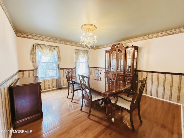 22 Enclosure Dr, Morganville, NJ 07751 - dining room with a chandelier, wainscoting, wood finished floors, and ornamental molding