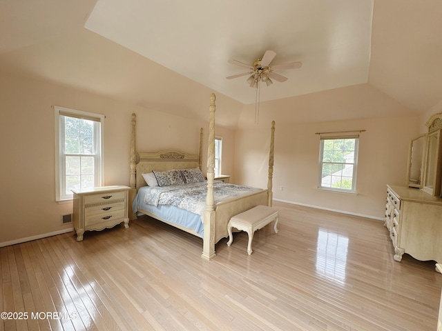 22 Enclosure Dr, Morganville, NJ 07751 - bedroom featuring multiple windows, light wood-style flooring, a ceiling fan, and vaulted ceiling
