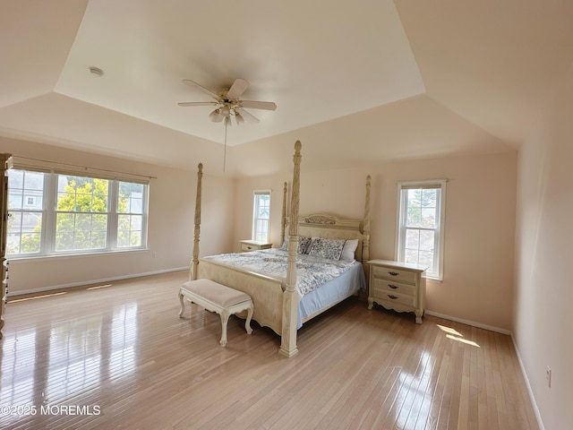 22 Enclosure Dr, Morganville, NJ 07751 - bedroom with multiple windows, light wood finished floors, and a ceiling fan
