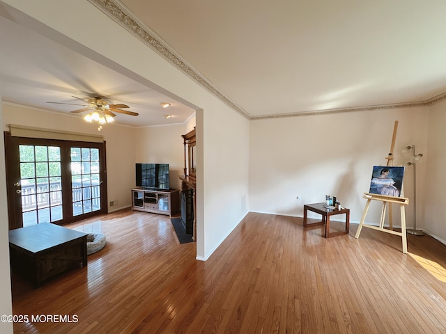 22 Enclosure Dr, Morganville, NJ 07751 - living area with crown molding, wood-type flooring, and a ceiling fan