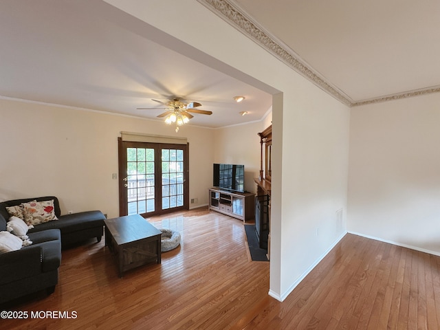 22 Enclosure Dr, Morganville, NJ 07751 - living area featuring wood finished floors, ornamental molding, ceiling fan, and a fireplace