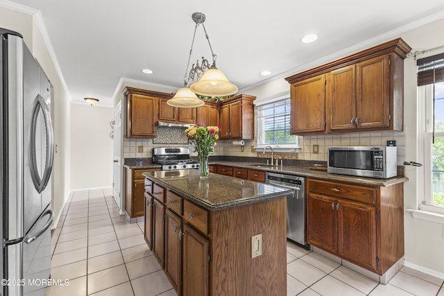 22 Enclosure Dr, Morganville, NJ 07751 - kitchen with stainless steel appliances, a center island, tasteful backsplash, light tile patterned flooring, and pendant lighting